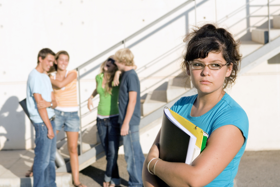 bigstock-outcast-sad-girl-at-university-16236611