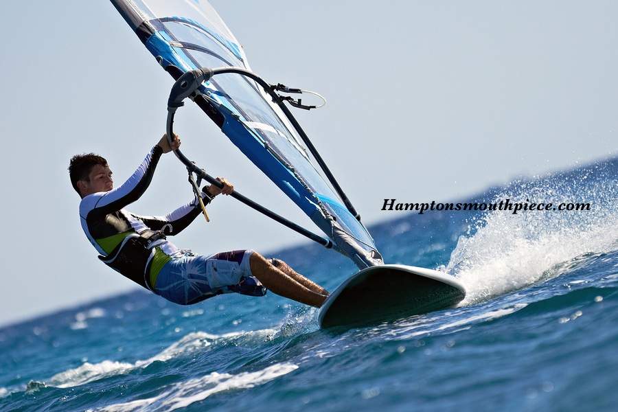 Side view of young windsurfer